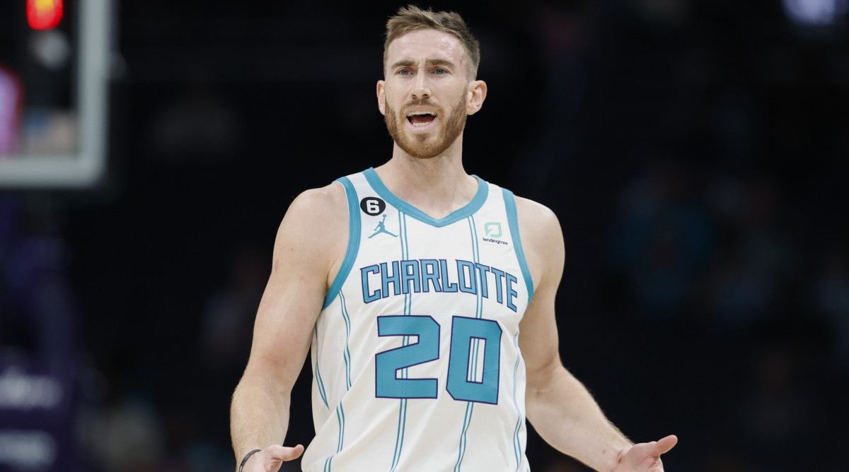 Hornets guard Gordon Hayward raises his arms to question a call