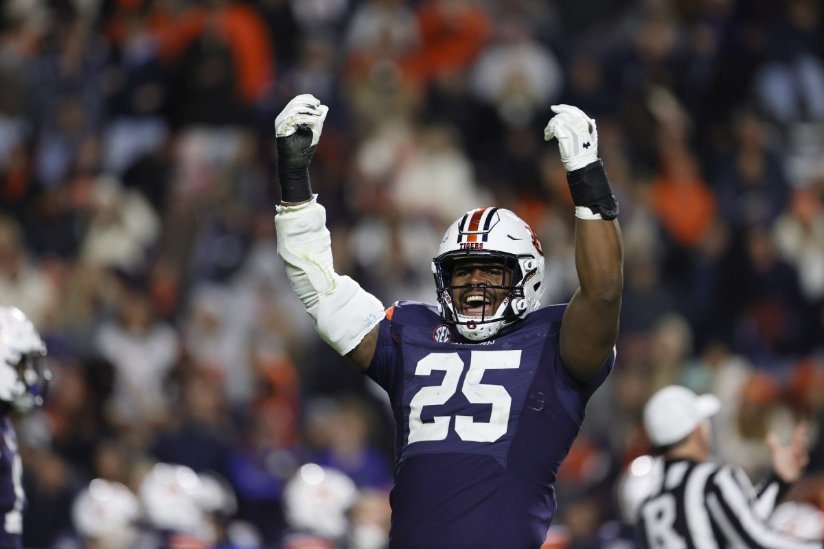 Nov 12, 2022; Auburn, Alabama, USA; Auburn Tigers defensive end Colby Wooden (25) tries to get the fans excited starting the fourth quarter against the Texas A&M Aggies at Jordan-Hare Stadium. Mandatory Credit: John Reed-USA TODAY Sports