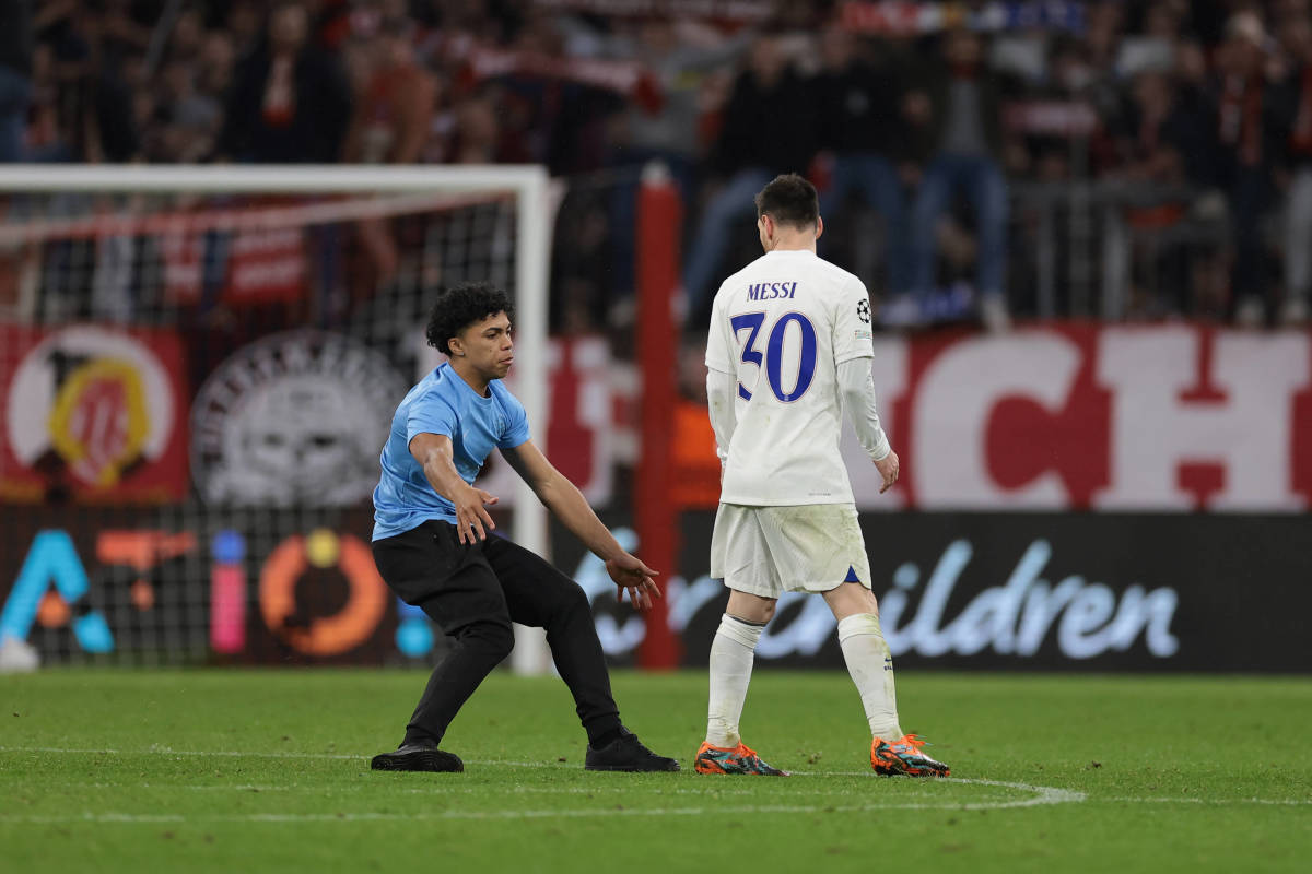 A pitch invader pictured falling to the floor while attempting to touch Lionel Messi after PSG's 2-0 defeat at Bayern Munich in March 2023