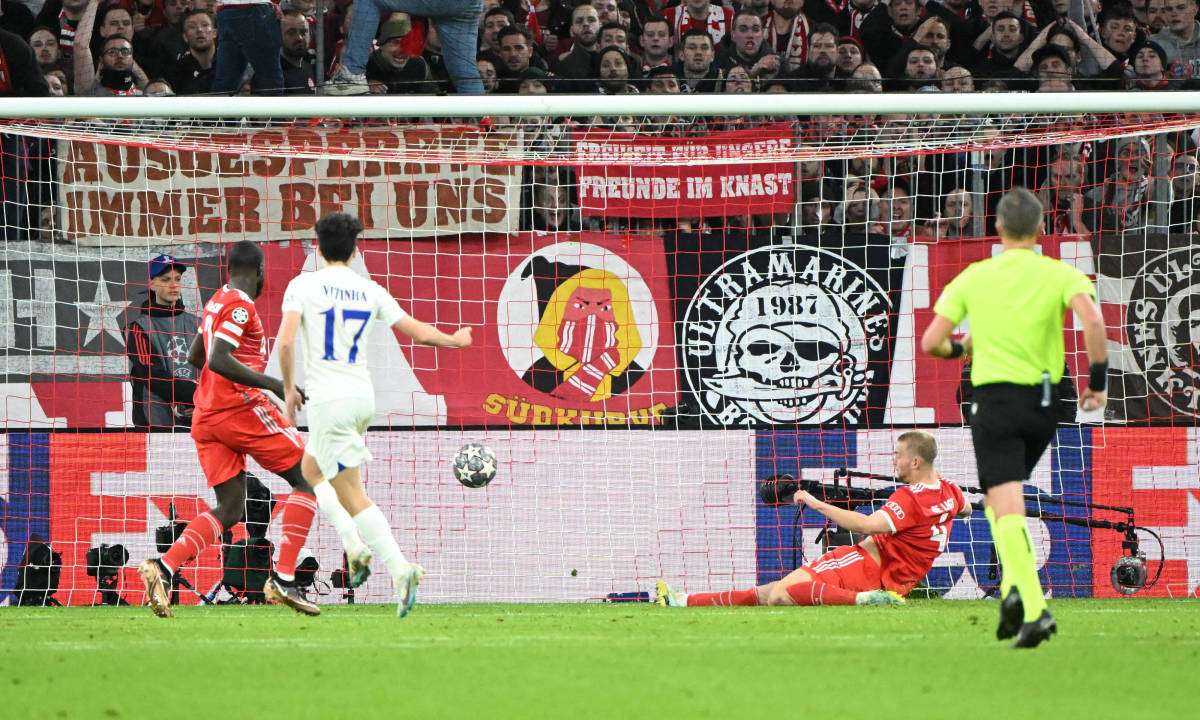 Bayern Munich defender Matthijs de Ligt pictured (bottom right) sliding to clear the ball and deny PSG a goal during a UEFA Champions League game in March 2023