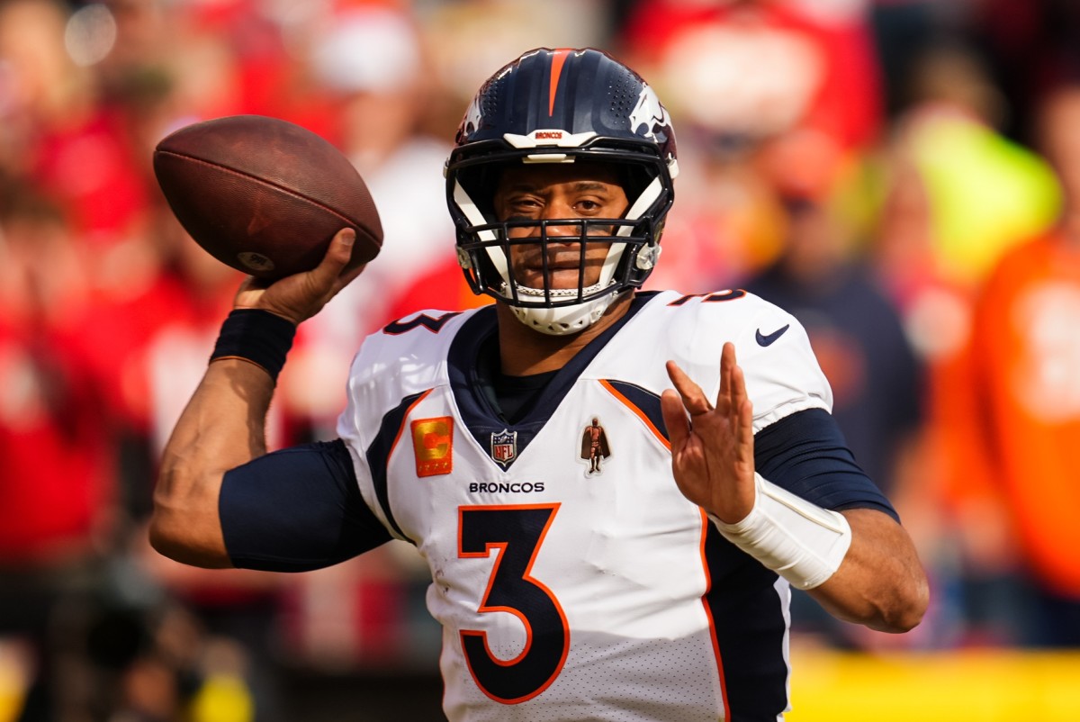 Jan 1, 2023; Kansas City, Missouri, USA; Denver Broncos quarterback Russell Wilson (3) throws a pass during the first half against the Kansas City Chiefs at GEHA Field at Arrowhead Stadium.