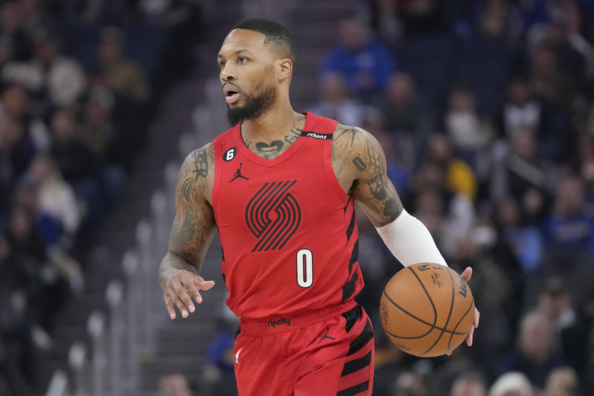 Portland Trail Blazers guard Damian Lillard brings the ball up the court against the Golden State Warriors.