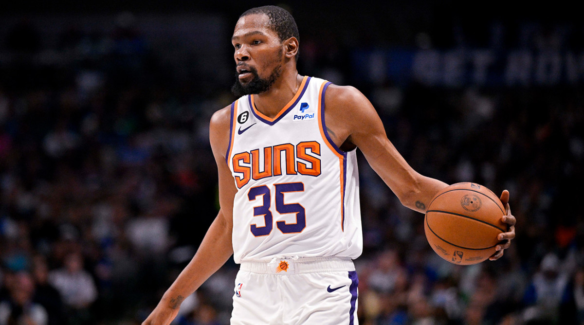 Suns’ Kevin Durant dribbles the basketball.