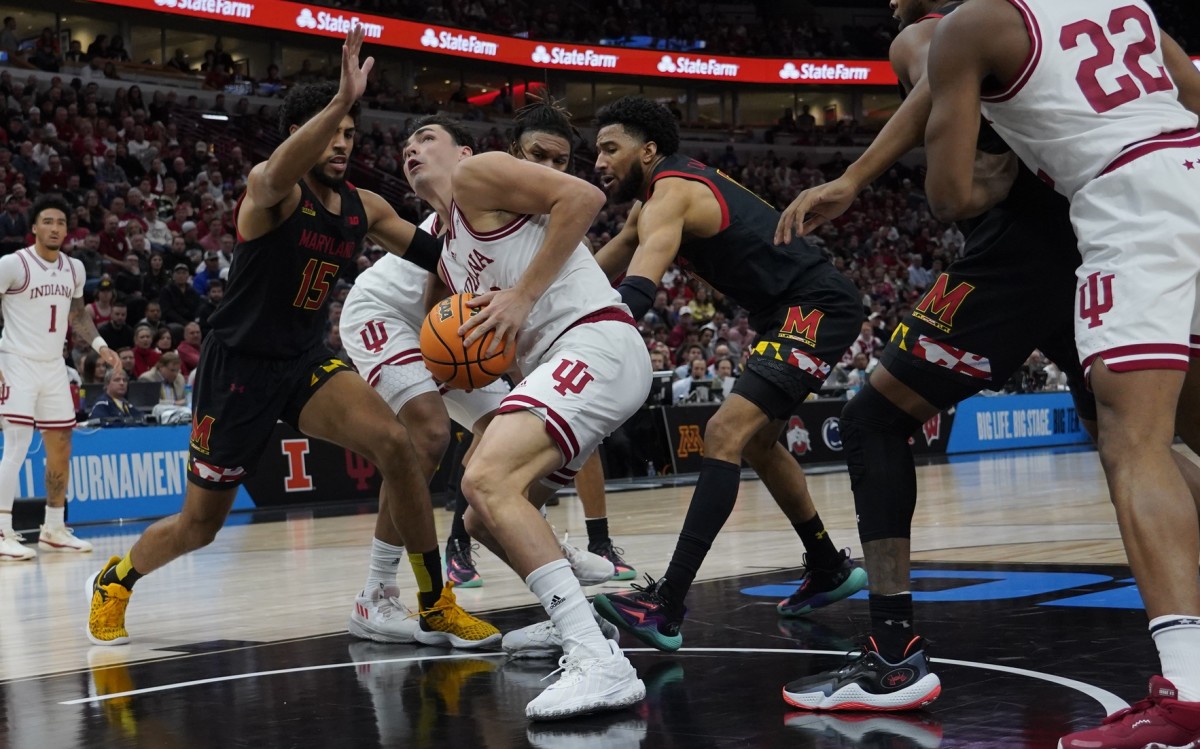 Indiana Hoosiers guard Trey Galloway (32) attempts a shot while Maryland's Patrick Emilien (15) defends during the first half at United Center.
