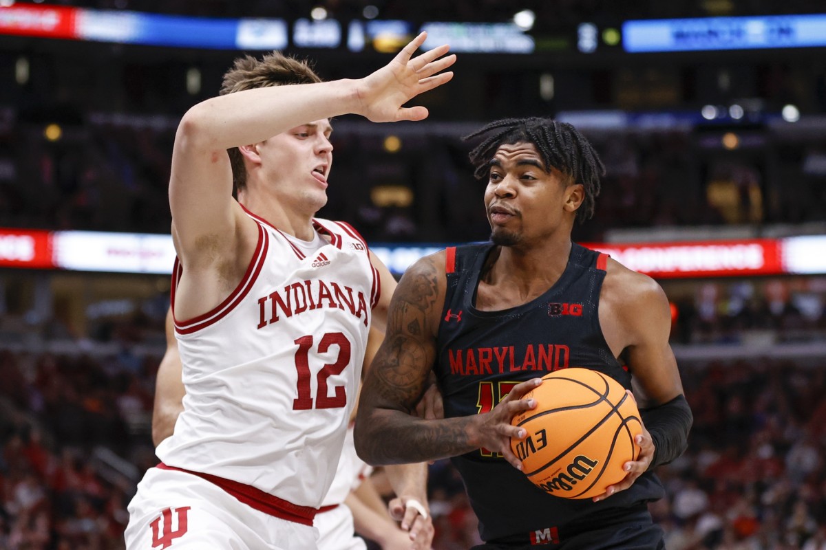 Maryland Terrapins guard Hakim Hart (13) drives to the basket against Indiana Hoosiers forward Miller Kopp (12) during the first half at United Center.