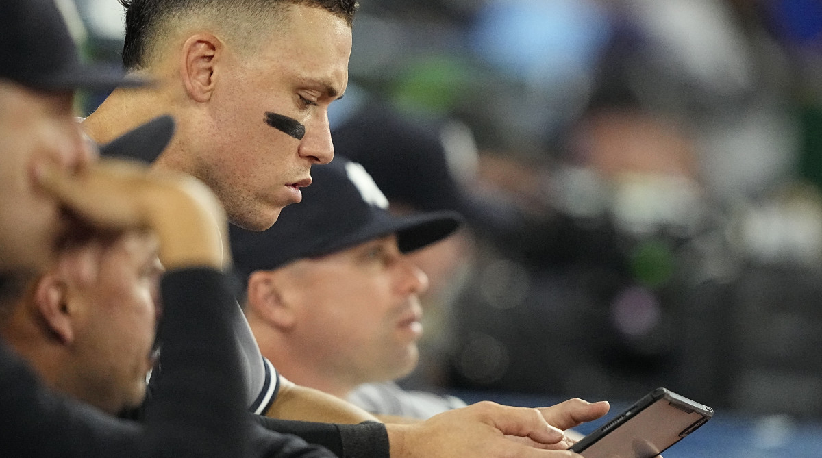 Yankees right fielder Aaron Judge reviews a play on a tablet.
