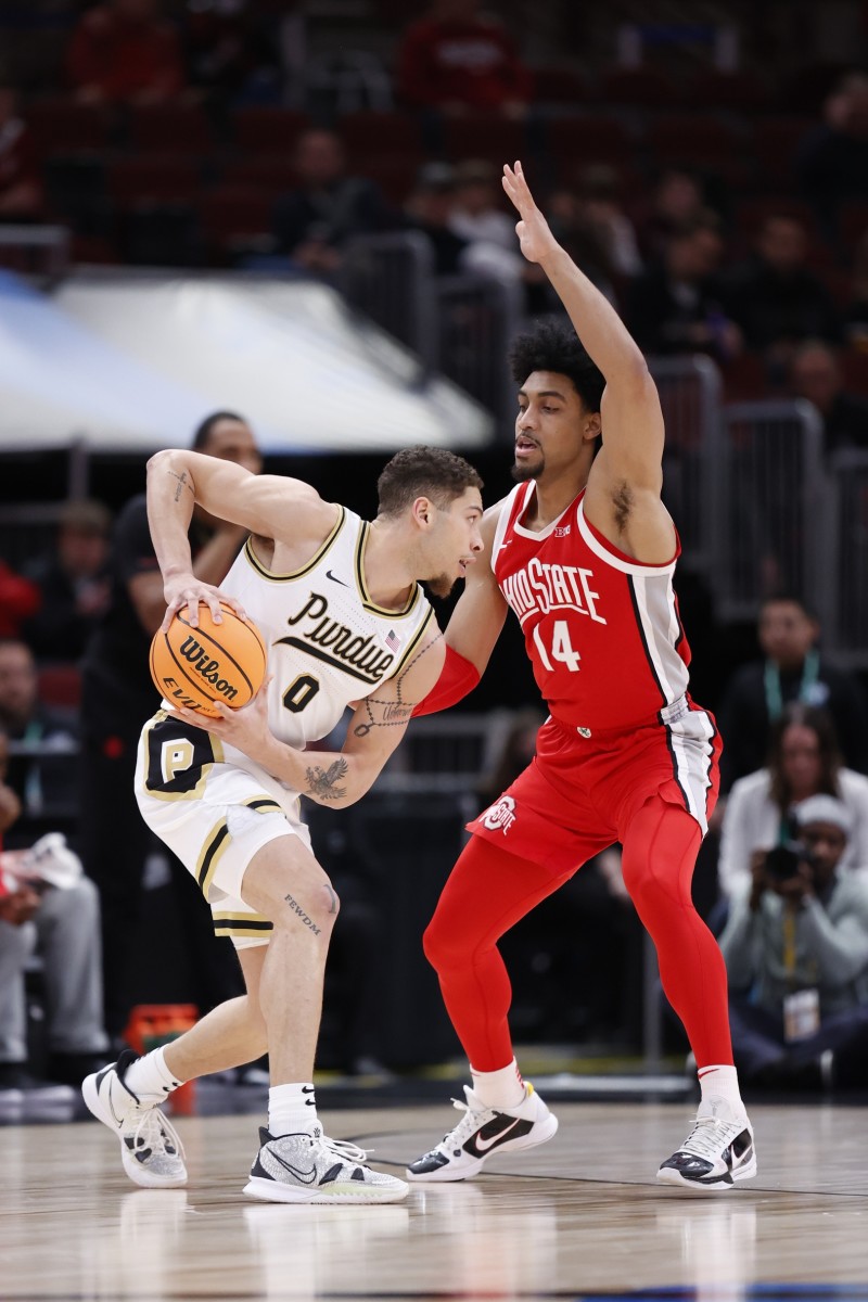 Ohio State Buckeyes forward Justice Sueing (14) defends against Purdue Boilermakers forward Mason Gillis (0) during the first half at United Center.