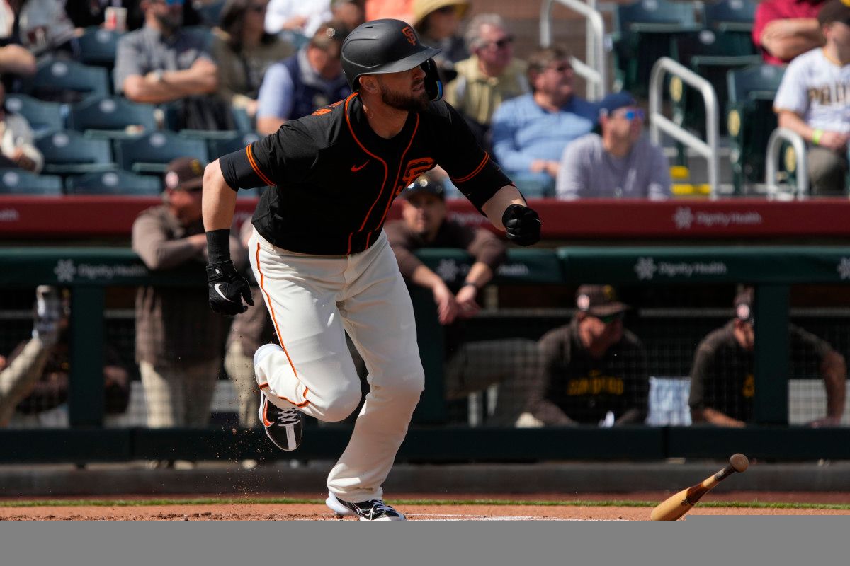 SF Giants right fielder Mitch Haniger (17) hits against the San Diego Padres in the first inning at Scottsdale Stadium. (2023)