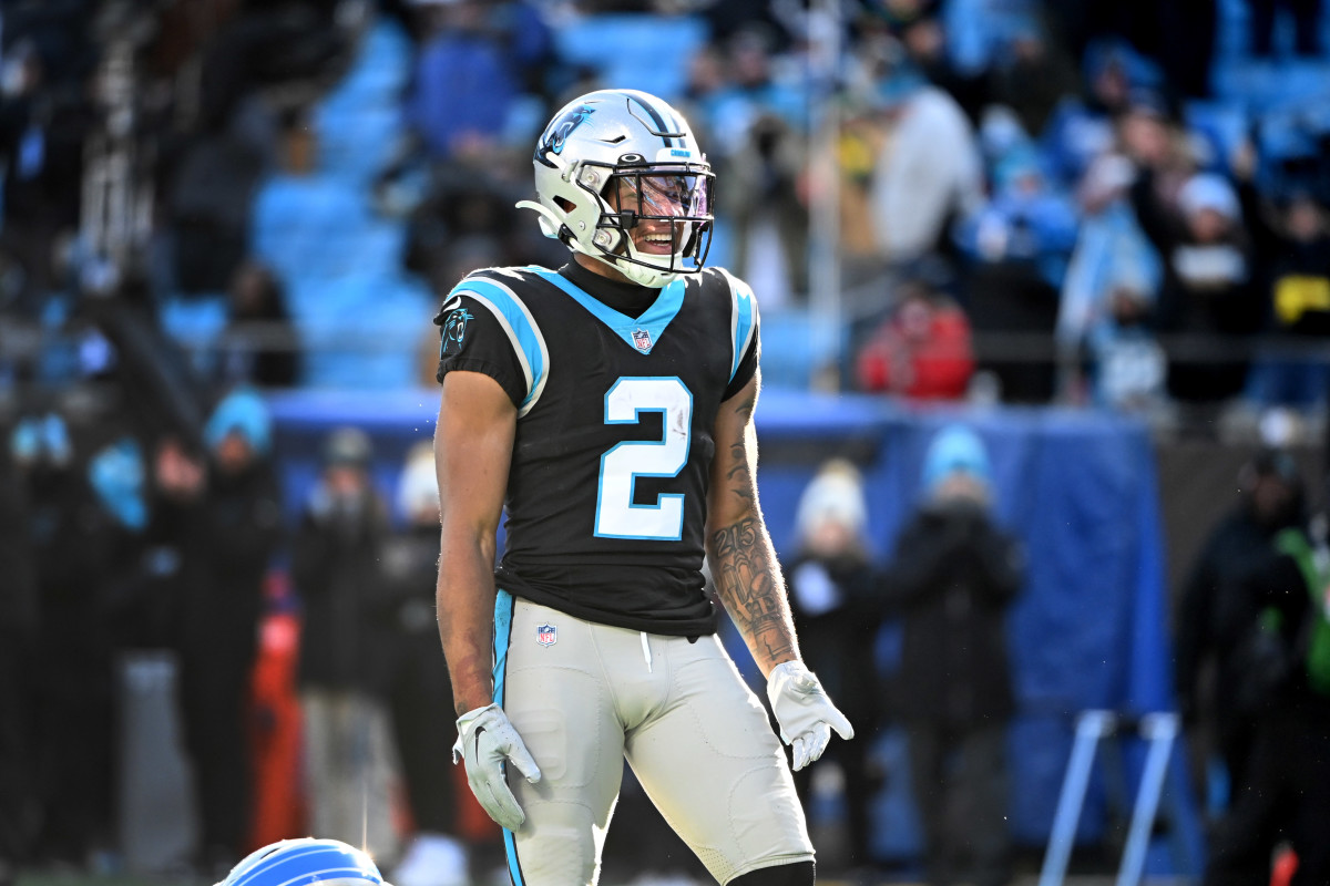 Carolina Panthers wide receiver DJ Moore stands in uniform smiling