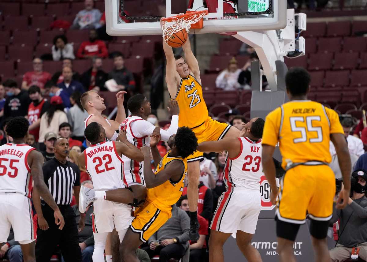 owson Tigers guard Nicolas Timberlake (25) dunks over Ohio State Buckeyes forward Zed Key (23) during the second half of the NCAA men's basketball game at Value City Arena in Columbus on Wednesday, Dec. 8, 2021. Towson Tigers At Ohio State Buckeyes Basketball