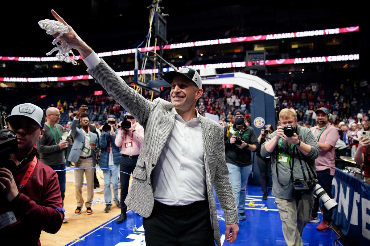 Alabama head coach Nate Oats leaves the court with the net after winning the championship SEC Men s Basketball Tournament game over Texas A&M at Bridgestone Arena Sunday, March 12, 2023, in Nashville, Tenn.