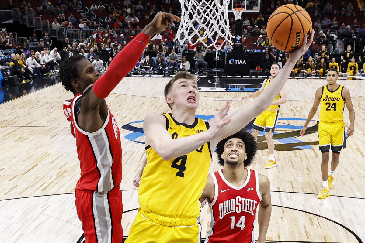 Mar 9, 2023; Chicago, IL, USA; Iowa Hawkeyes guard Josh Dix (4) drives to the basket against the Ohio State Buckeyes during the first half at United Center. Mandatory Credit: Kamil Krzaczynski-USA TODAY Sports