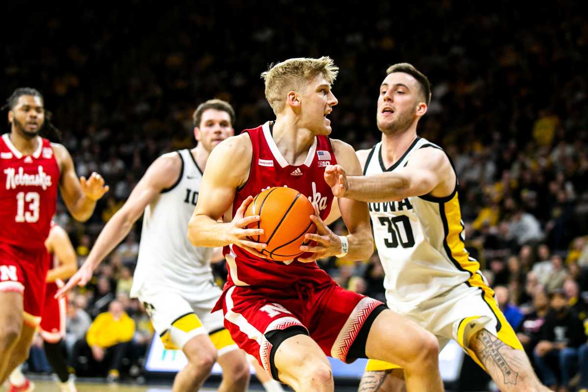 Nebraska guard Sam Griesel drives to the basket as Iowa guard Connor McCaffery, right, defends during a NCAA Big Ten Conference men's basketball game, Sunday, March 5, 2023, at Carver-Hawkeye Arena in Iowa City, Iowa. 230305 Nebraska Iowa Mbb 053 Jpg
