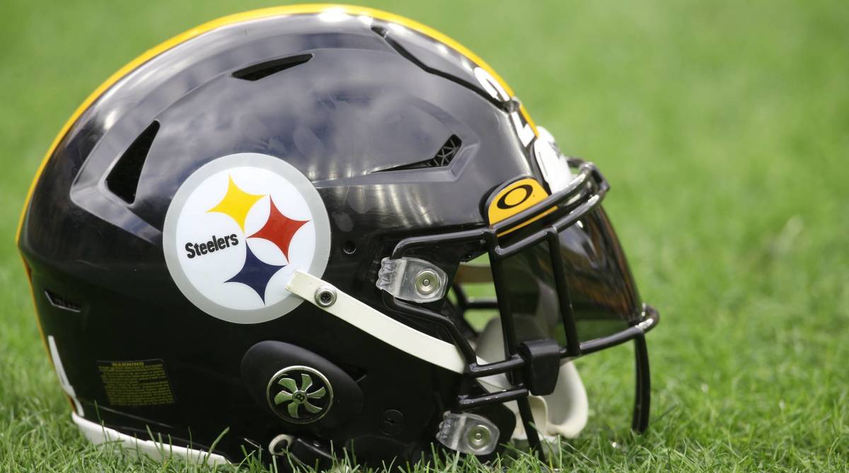 A Pittsburgh Steelers helmet sits on the field before a game.