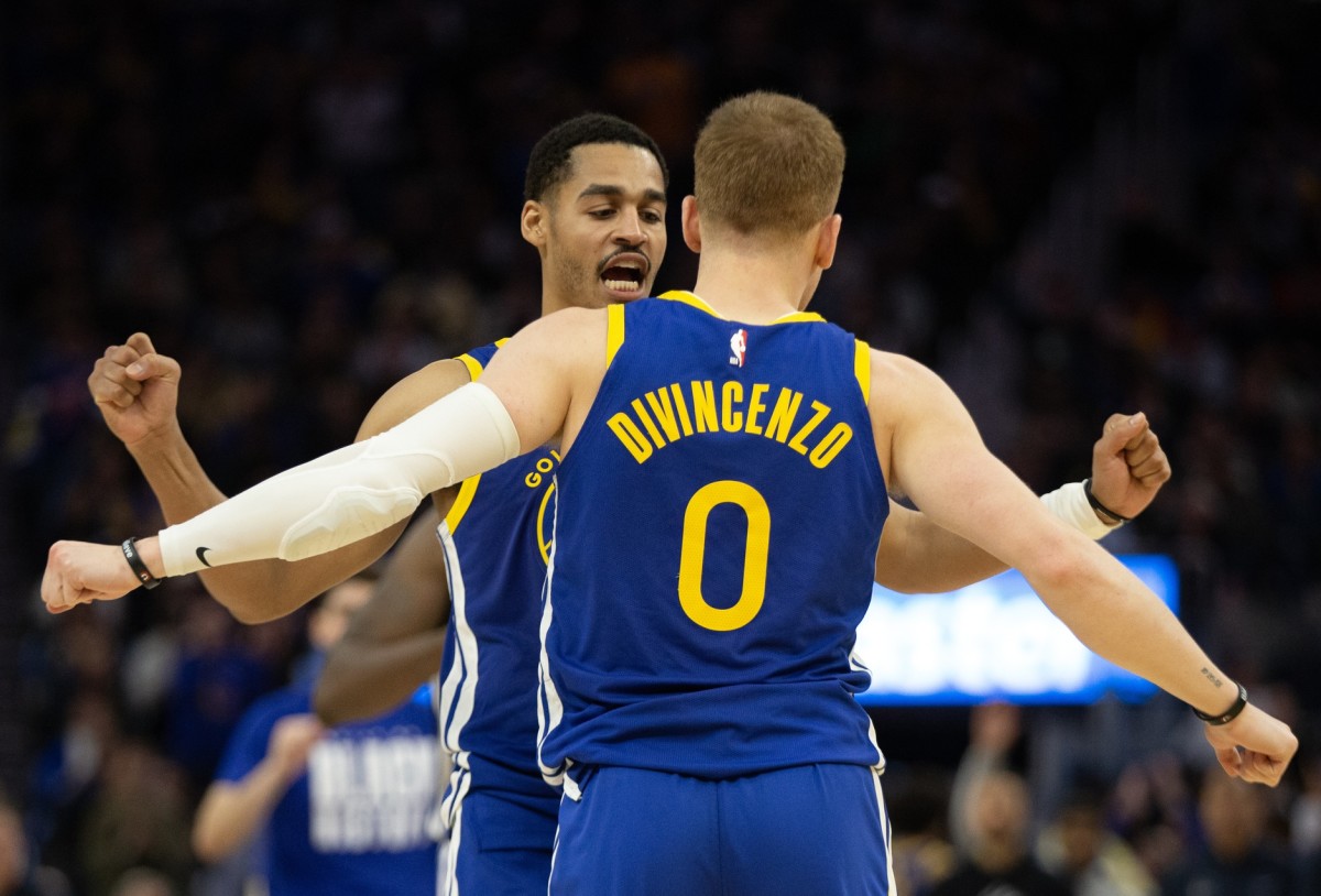 Golden State Warriors guard Jordan Poole (left) and teammate Donte DiVincenzo (0)