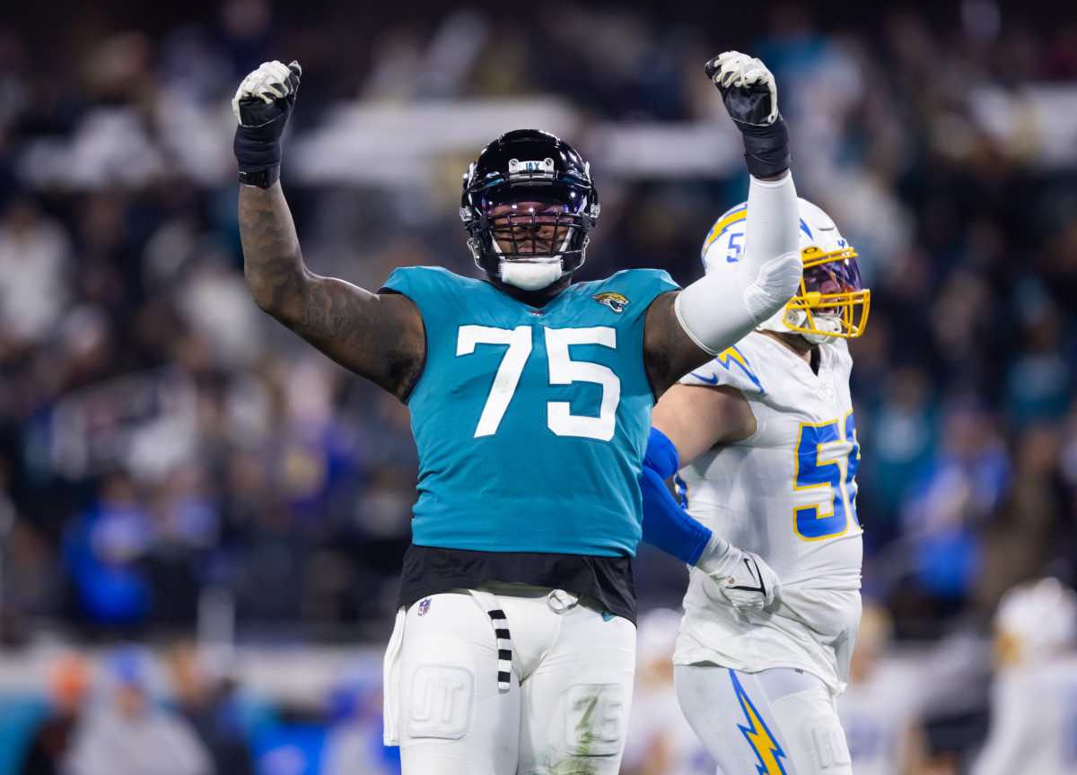 Jan 14, 2023; Jacksonville, Florida, USA; Jacksonville Jaguars offensive tackle Jawaan Taylor (75) reacts against the Los Angeles Chargers during a wild card playoff game at TIAA Bank Field. Mandatory Credit: Mark J. Rebilas-USA TODAY Sports