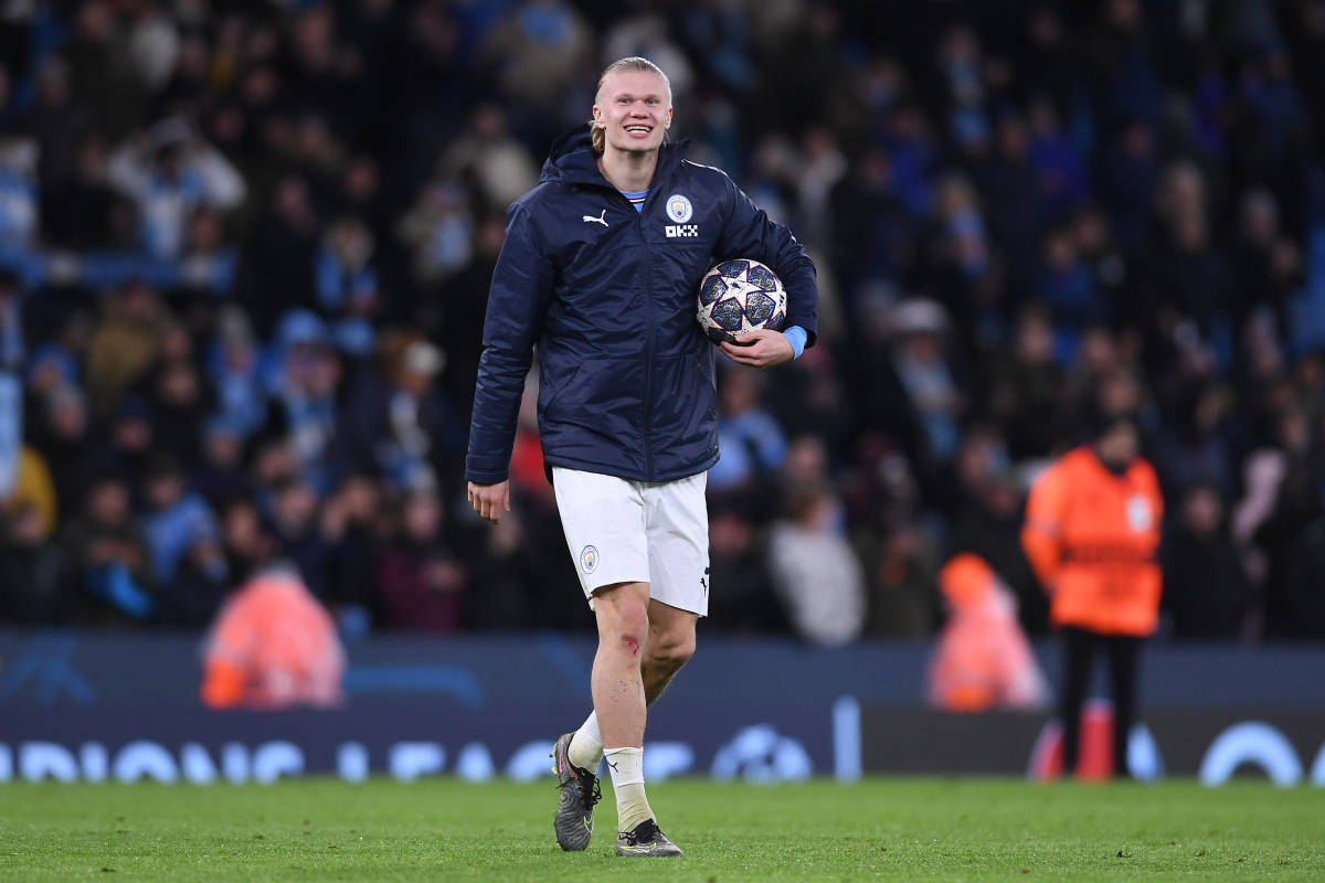 Erling Haaland pictured holding the match ball after scoring five goals during Manchester City's 7-0 win over RB Leipzig in March 2023