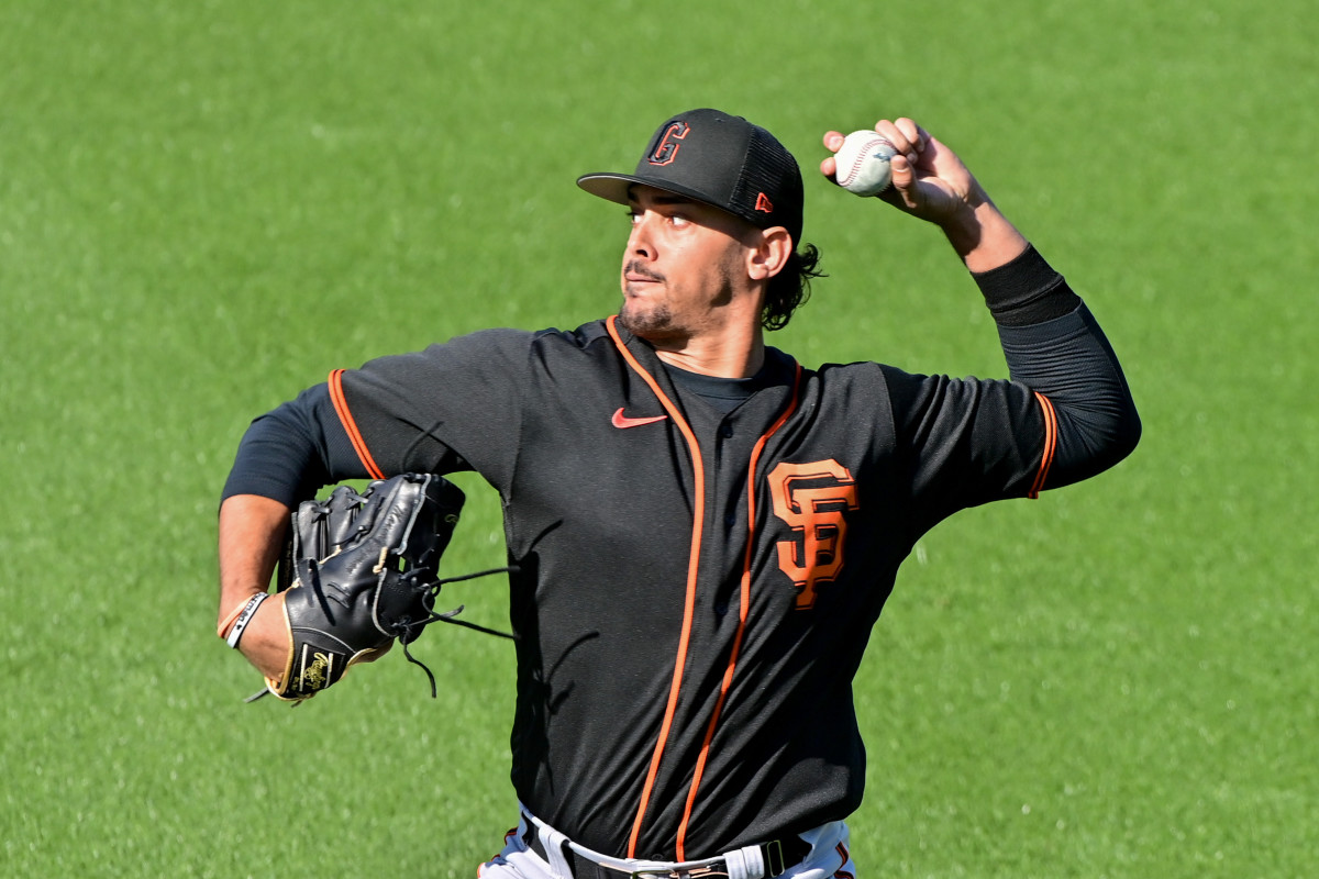 SF Giants pitcher Ronald Guzmán throws during a Spring Training workout at Scottsdale Stadium. (2023)