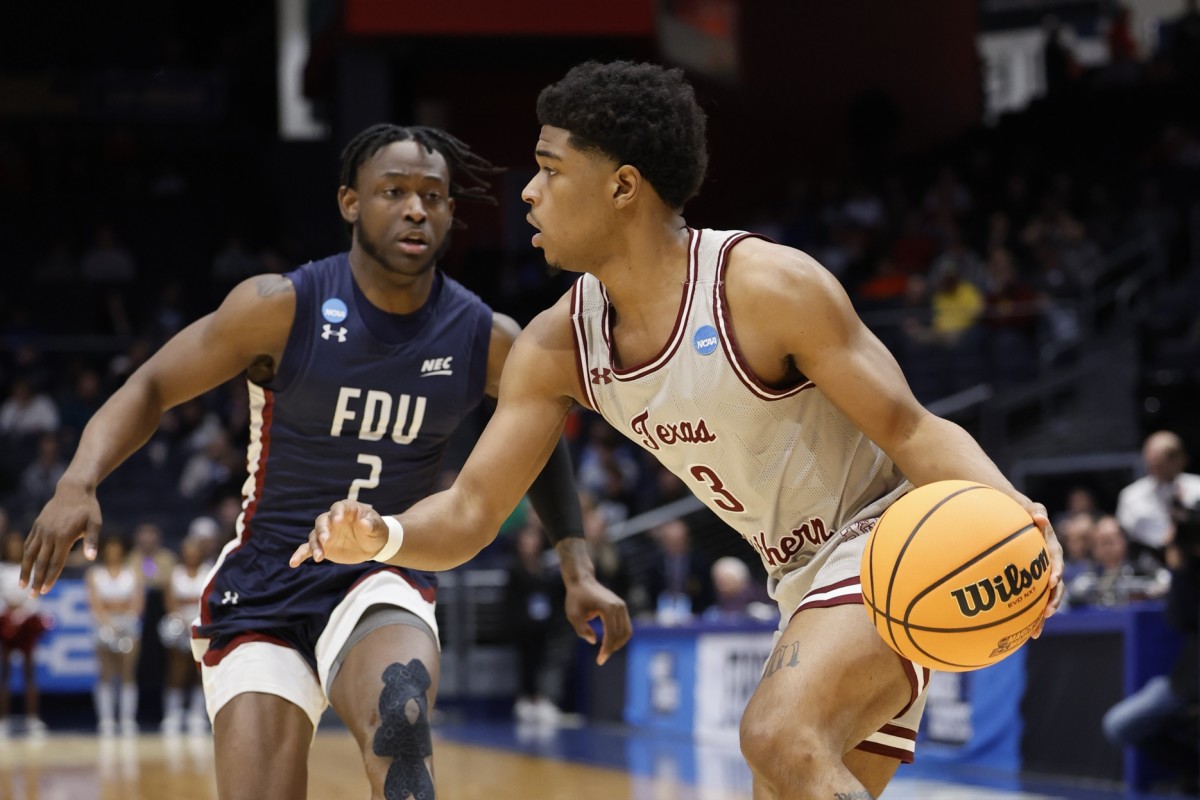 Texas Southern Tigers guard PJ Henry (3) is defended by Fairleigh Dickinson Knights guard Demetre Roberts (2) at UD Arena.