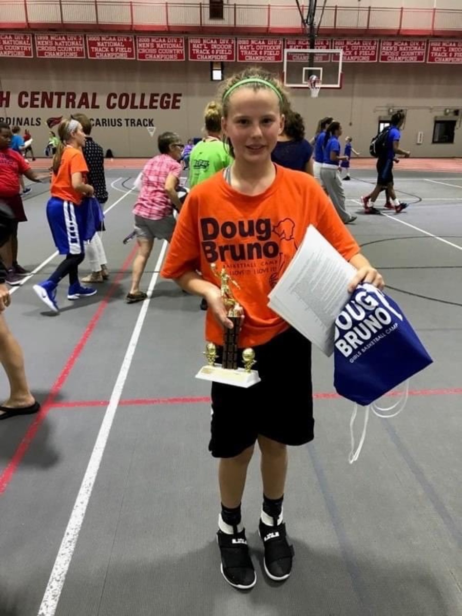 Little Lenée Beaumont competes at Doug Bruno Basketball Camp and earns first place on the WNBA Team and top memorial award.