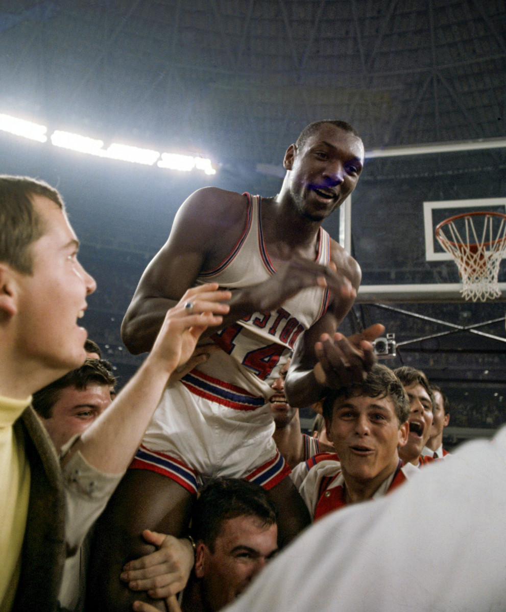 Elvin Hayes is carried off the Astrodome court after Houston beat UCLA.