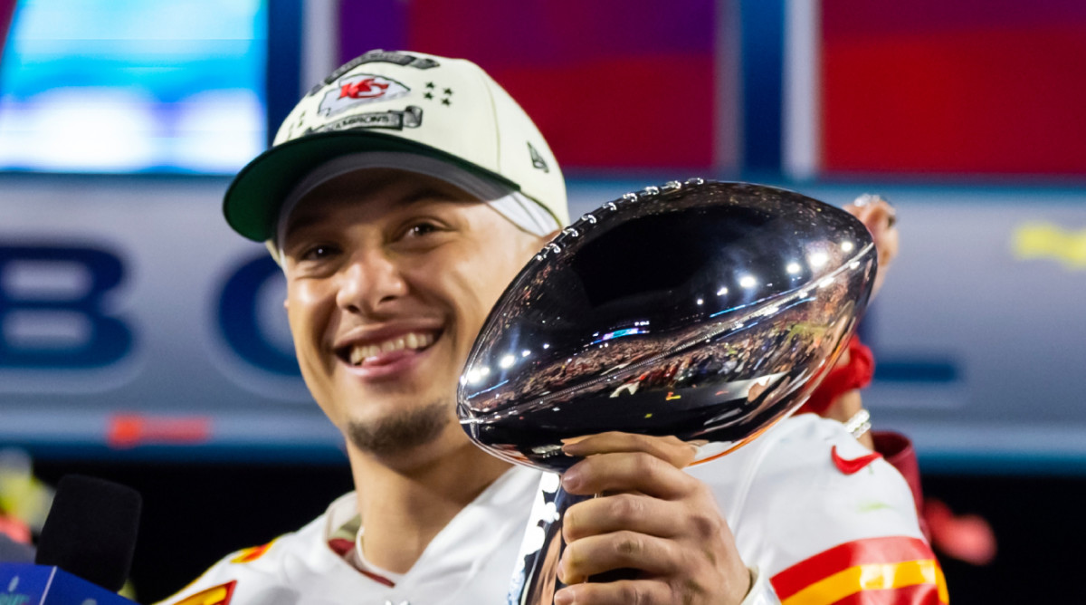 Chiefs quarterback Patrick Mahomes smiles with the Lombardi Trophy after the team won Super Bowl LVII.