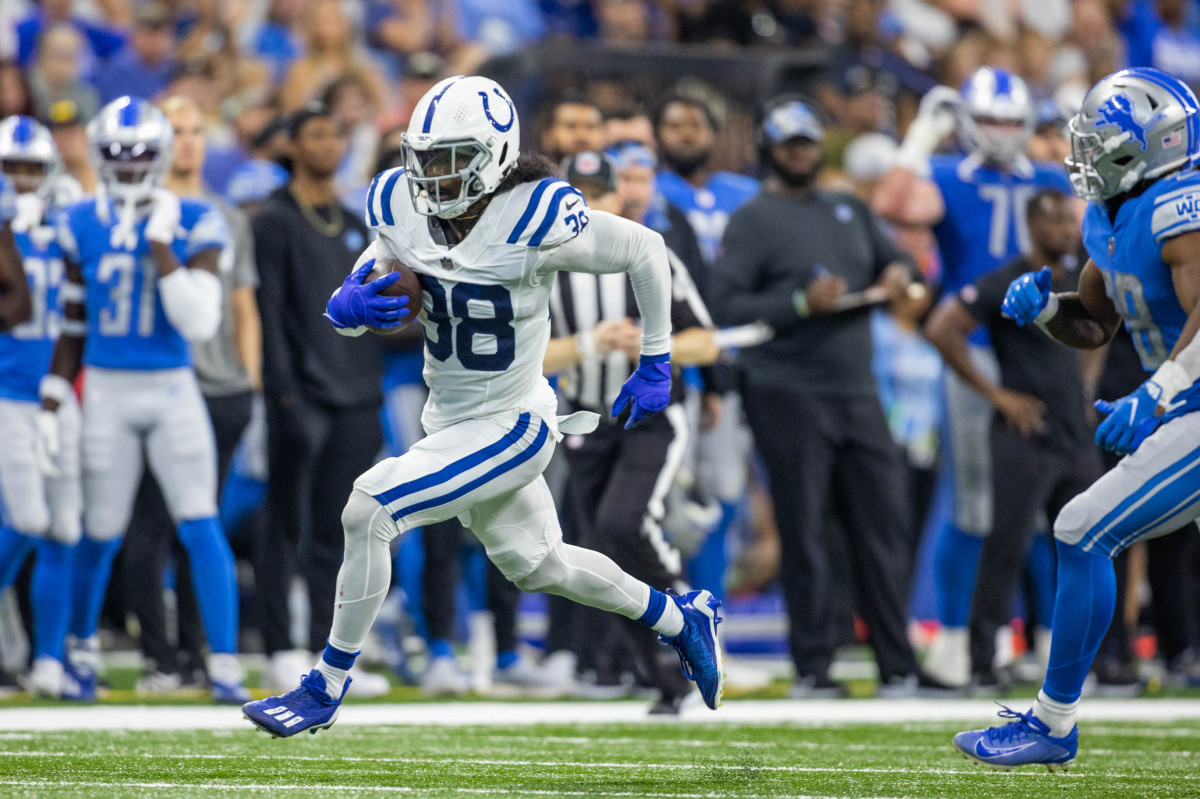 Aug 20, 2022; Indianapolis, Indiana, USA; Indianapolis Colts cornerback Tony Brown (38) runs with the ball after an interception in the second quarter against the Detroit Lions at Lucas Oil Stadium.