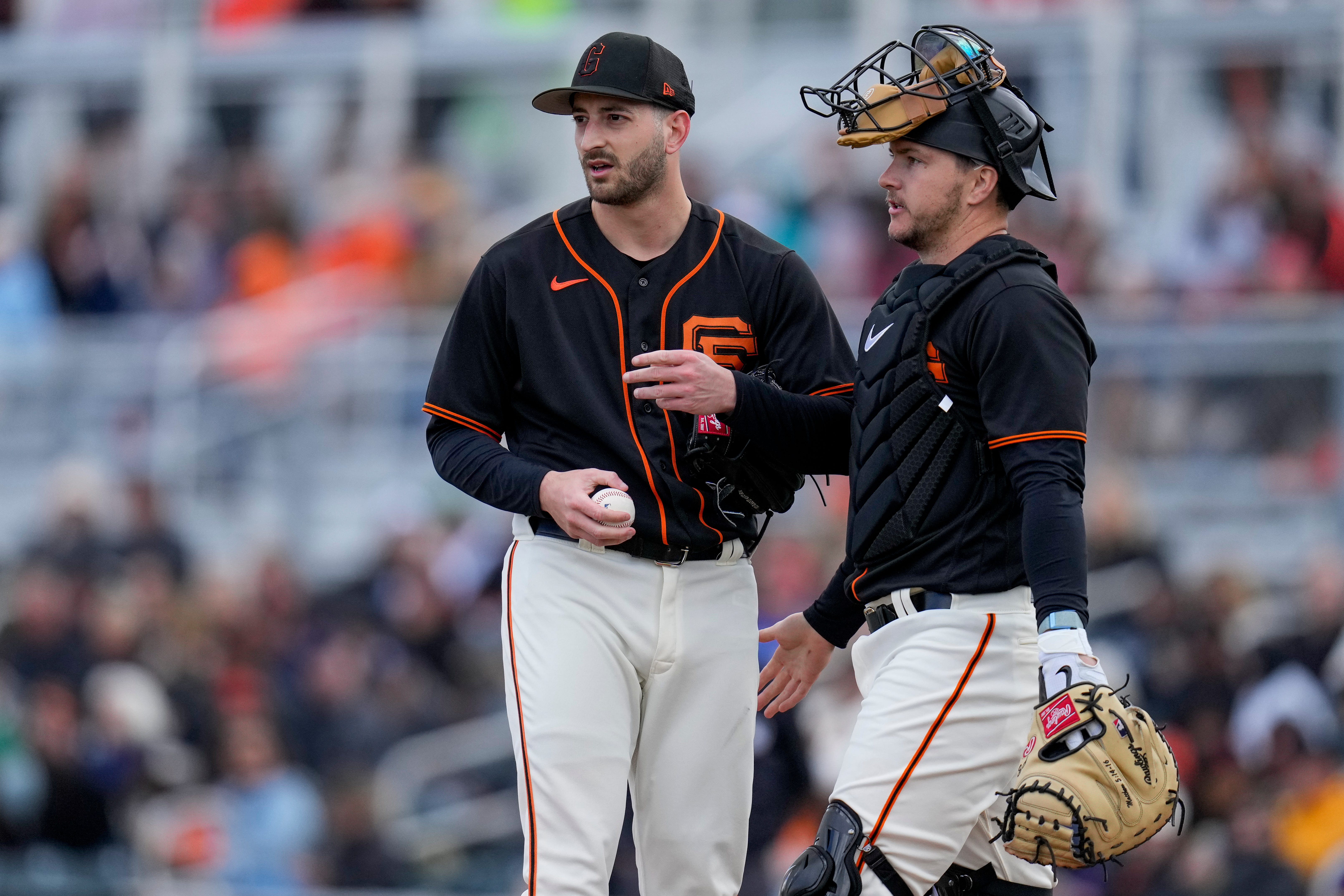 SF Giants pitcher Thomas Szapucki is visited at the mound by catcher Patrick Bailey in the sixth inning of the MLB Cactus League spring training game. (2023)