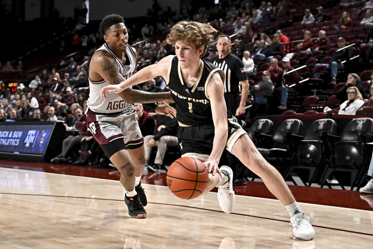 Dec 20, 2022; College Station, Texas, USA; Texas A&M Aggies guard Wade Taylor IV (4) presses Wofford Terriers guard Jackson Paveletzke (1) on the inbound pass during the second half at Reed Arena.