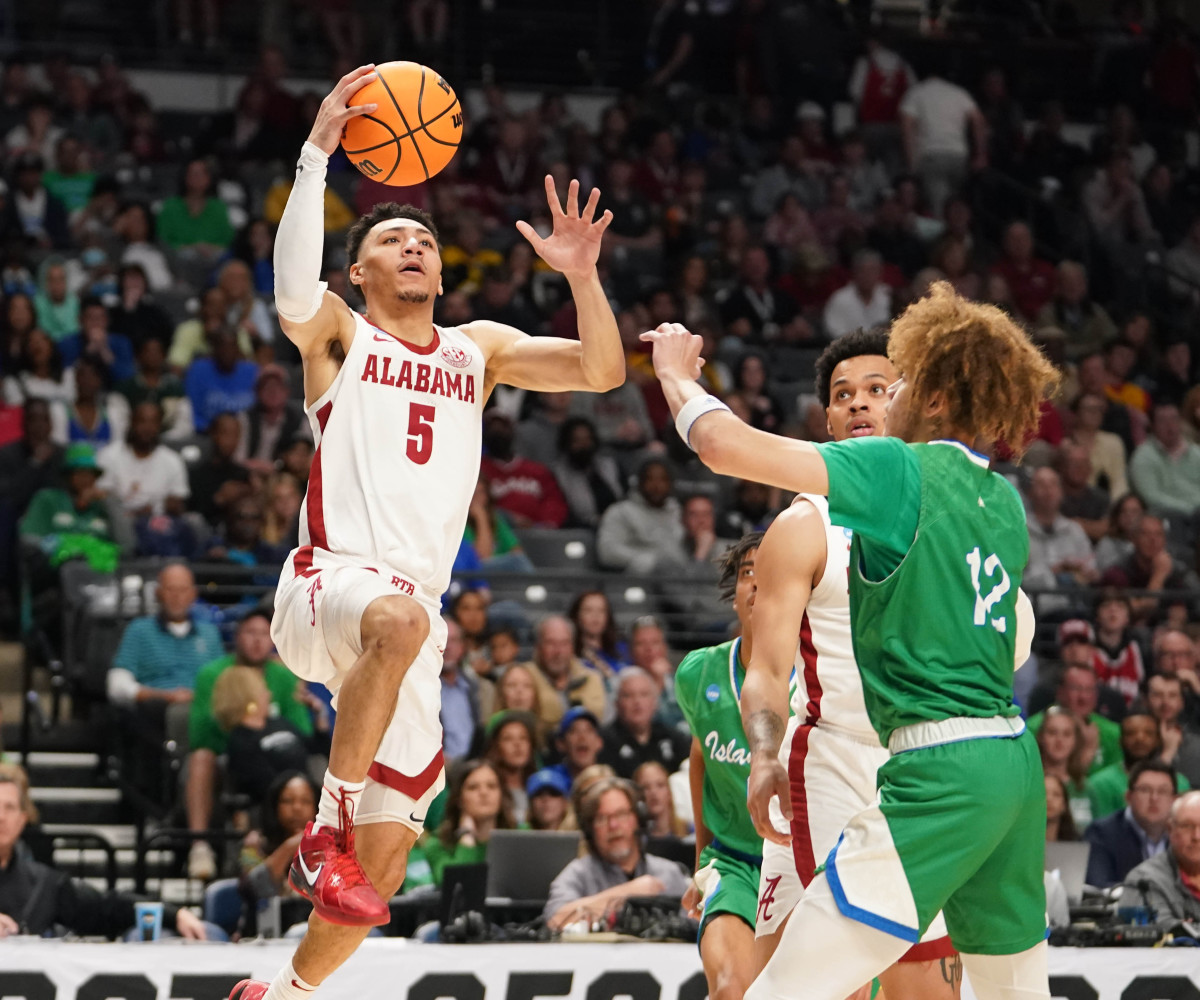 Mar 16, 2023; Birmingham, AL, USA; Alabama Crimson Tide guard Jahvon Quinerly (5) drives to the basket against the Texas A&M-CC Islanders during the first half in the first round of the 2023 NCAA Tournament at Legacy Arena. Mandatory Credit: Marvin Gentry-USA TODAY Sports