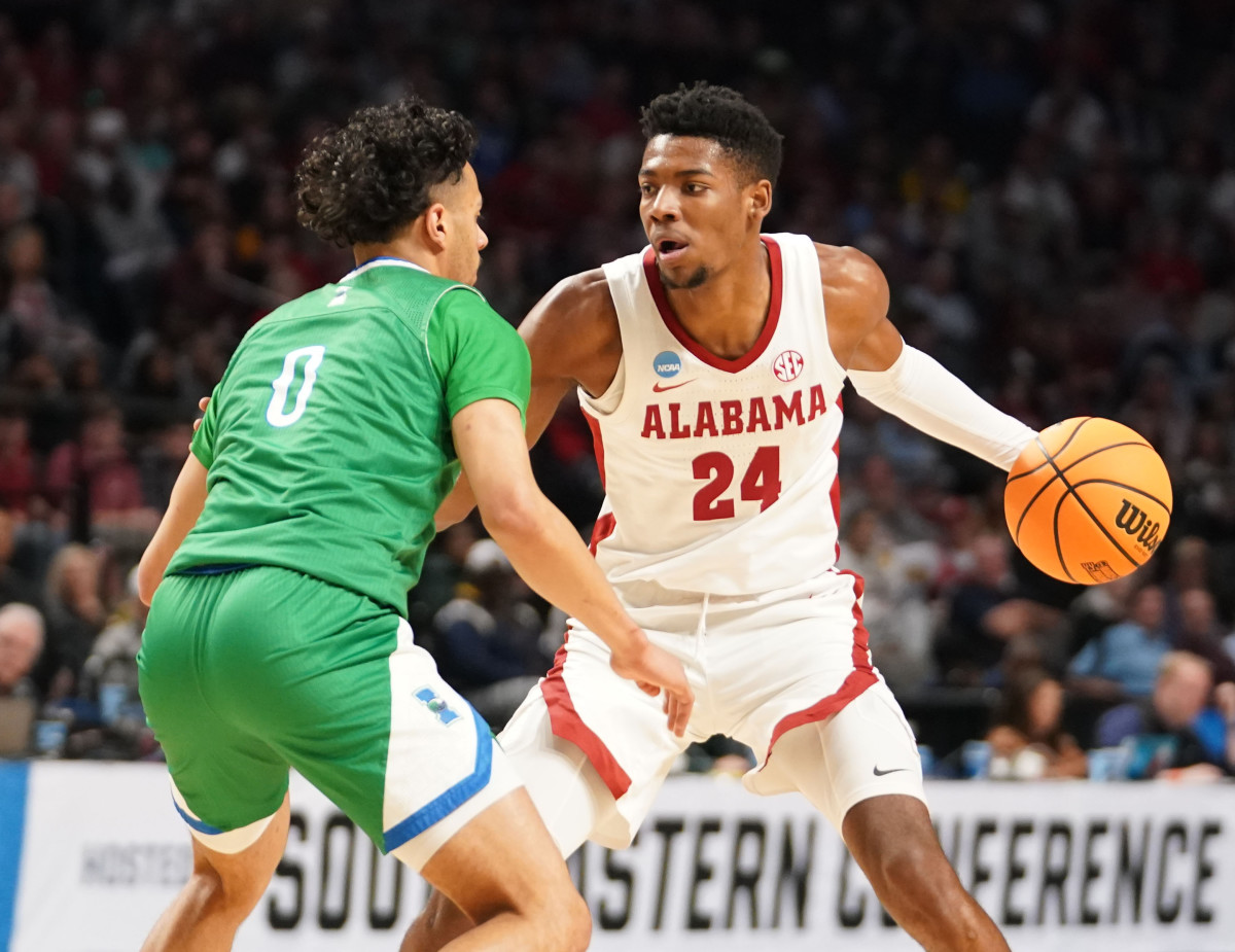 Mar 16, 2023; Birmingham, AL, USA; Alabama Crimson Tide forward Brandon Miller (24) is defended by Texas A&M-CC Islanders guard Trevian Tennyson (0) during the first half in the first round of the 2023 NCAA Tournament at Legacy Arena. Mandatory Credit: Marvin Gentry-USA TODAY Sports
