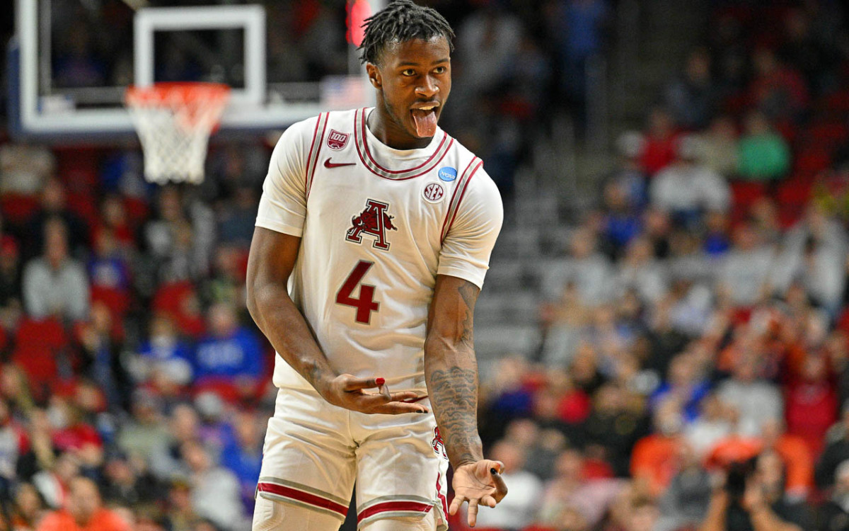 Hogs' Davonte Davis celebrates a three-pointer in NCAA Tournament win over Illinois.