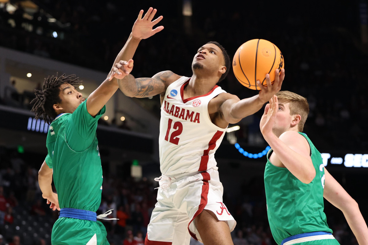 Mar 16, 2023; Birmingham, AL, USA; Alabama Crimson Tide guard Delaney Heard (12) shoots between Texas A&M-CC Islanders defenders during the second half in the first round of the 2023 NCAA Tournament at Legacy Arena.