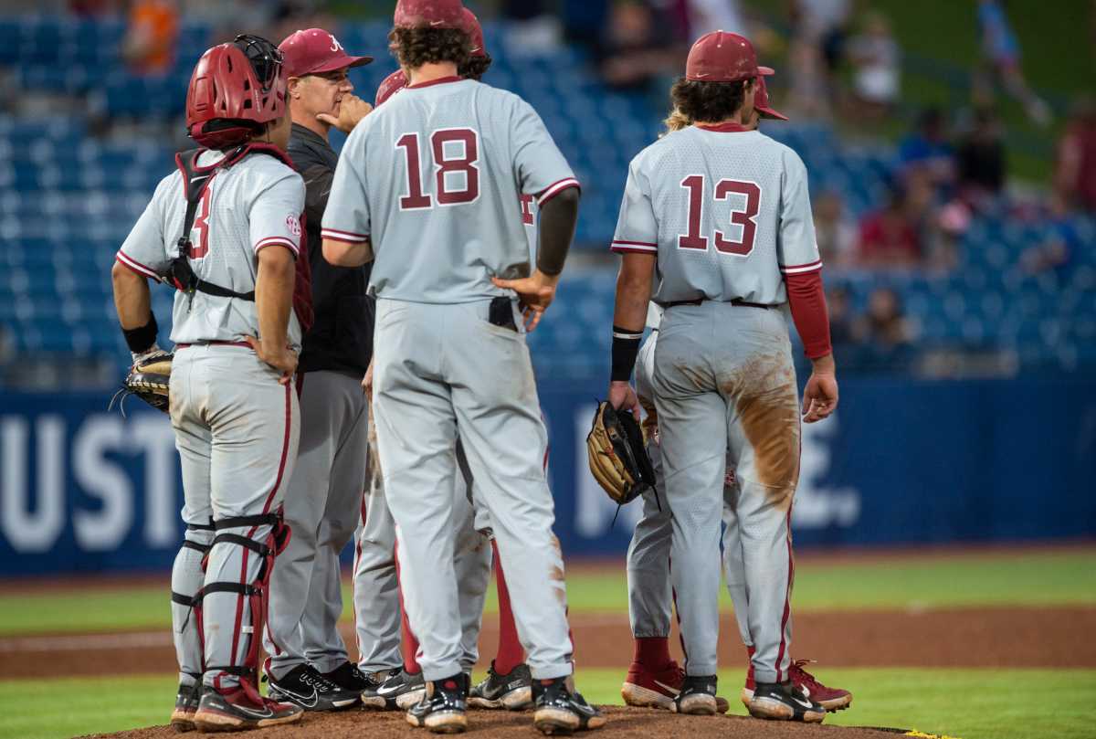 Alabama Crimson Tide pitching coach Jason Jackson talks with his team as they change the pitcher on the final out of the gameduring the SEC baseball tournament at Hoover Metropolitan Stadium in Hoover, Ala., on Wednesday, May 25, 2022.