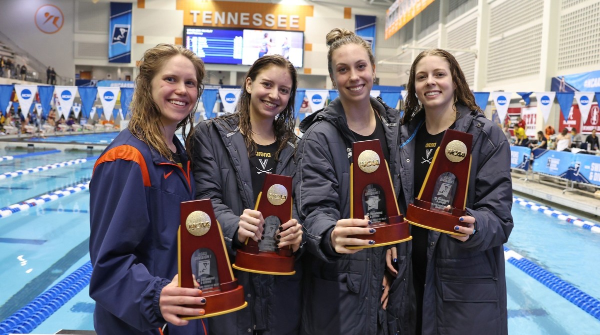 Lexi Cuomo, Kate Douglass, Gretchen Walsh, and Maxine Parker celebrate after winning the 200-yard freestyle relay title at the 2023 NCAA Women's Swimming & Diving Championships.