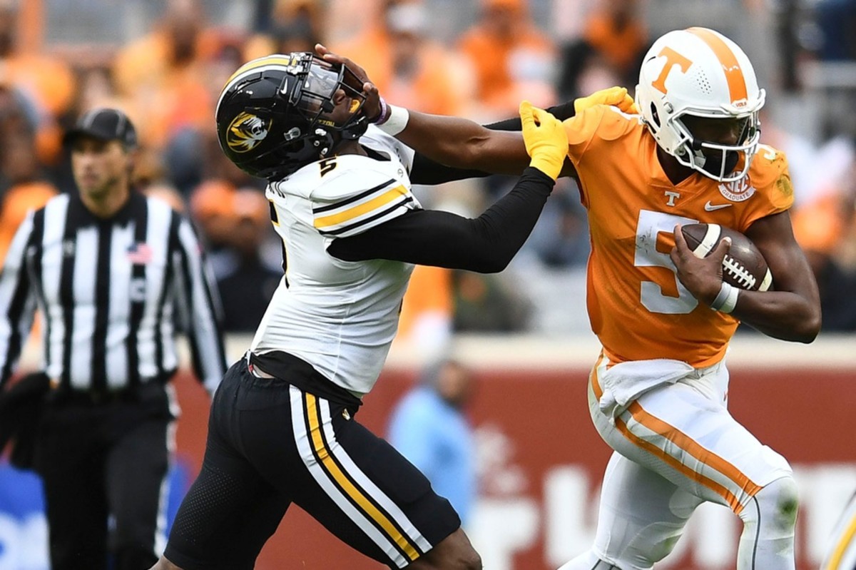 Tennessee quarterback Hendon Hooker (5) tries to hold back Missouri defensive lineman Tyrone Hopper II (5) during an NCAA college football game on Saturday, November 12, 2022 in Knoxville, Tenn. Ut Vs Missouri