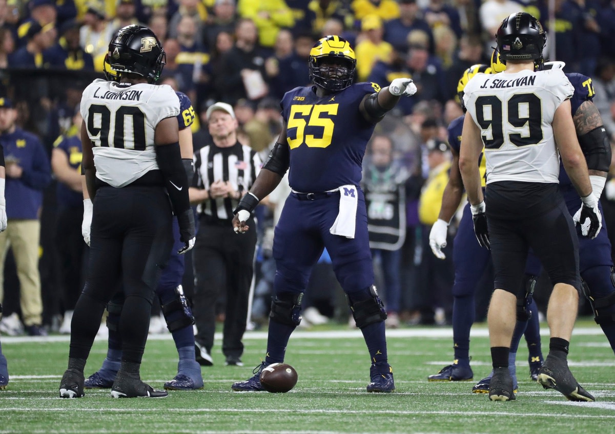 Michigan Wolverines offensive lineman Olusegun Oluwatimi (55) lines up against the Purdue Boilermakers during the first half of the Big Ten championship game at Lucas Oil Stadium in Indianapolis, Saturday, Dec. 3, 2022. Michiganbig 120322 Kd 4312