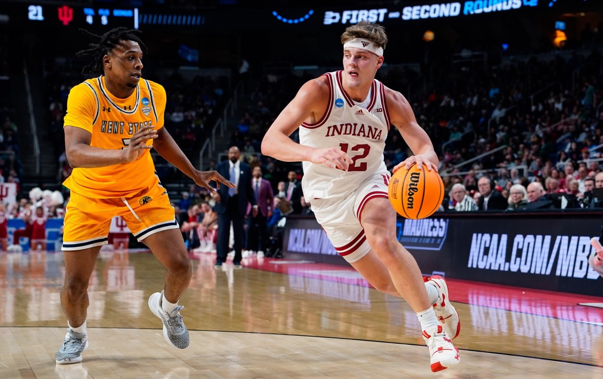 Indiana forward Miller Kopp (12) drives past Kent State guard Malique Jacobs (2) in the first half at MVP Arena. (Gregory Fisher-USA TODAY Sports)