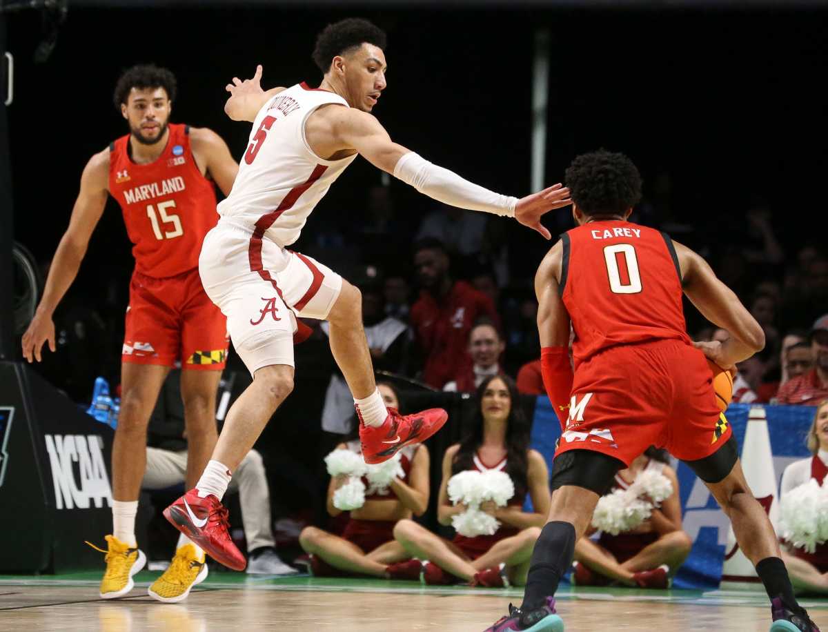 Alabama guard Jahvon Quinerly (5) guards Maryland guard Don Carey (0) at Legacy Arena during the second round of the NCAA Tournament.