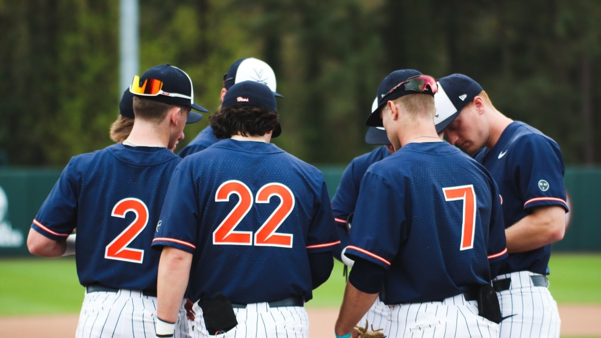 The Virginia baseball team huddles during the game against NC State in Raleigh, North Carolina.