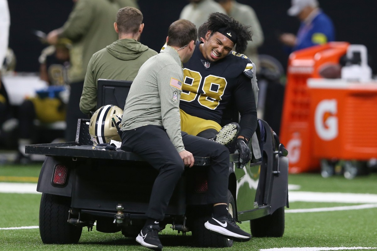 Nov 20, 2022; New Orleans Saints defensive end Payton Turner (98) is carted off the field with an injury in against the Los Angeles Rams. Mandatory Credit: Chuck Cook-USA TODAY Sports