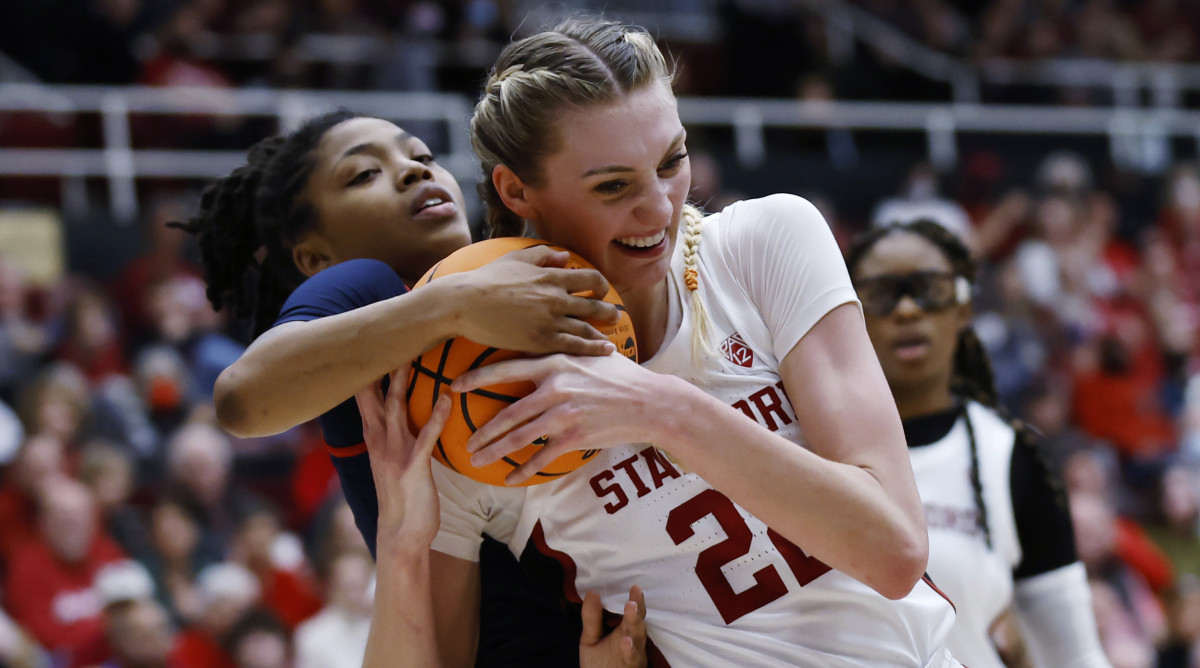 Mississippi guard Angel Baker and Stanford forward Cameron Brink  vie for the ball in the second round of the NCAA women’s tournament.