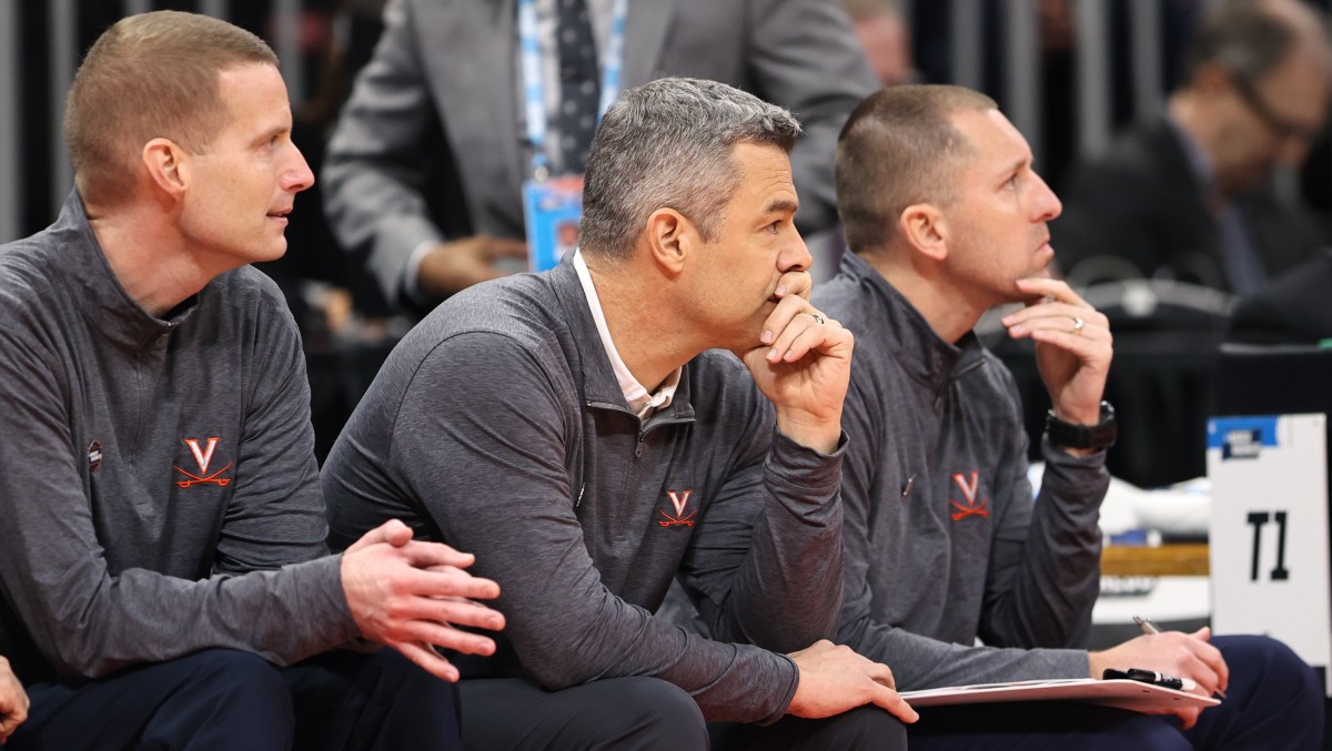 Virginia Cavaliers head coach Tony Bennett (center) looks on during the first half against the Furman Paladins at Amway Center.