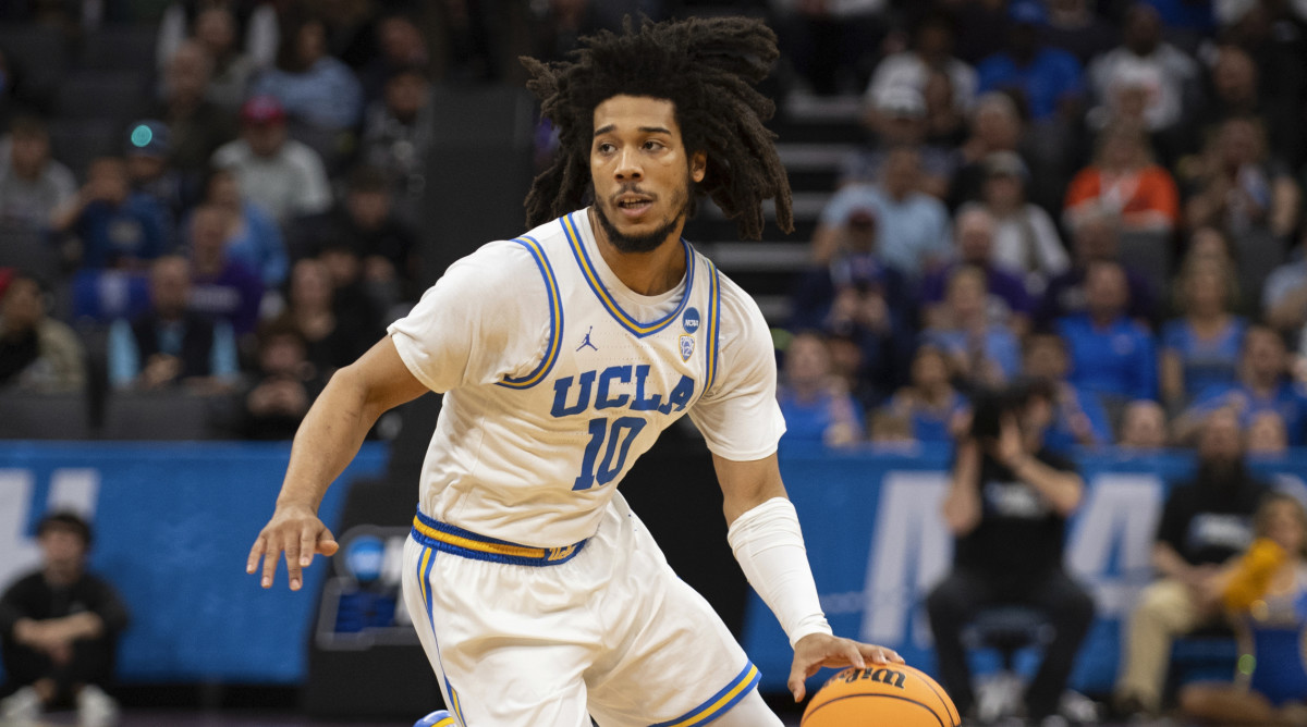 UCLA guard Tyger Campbell dribbles