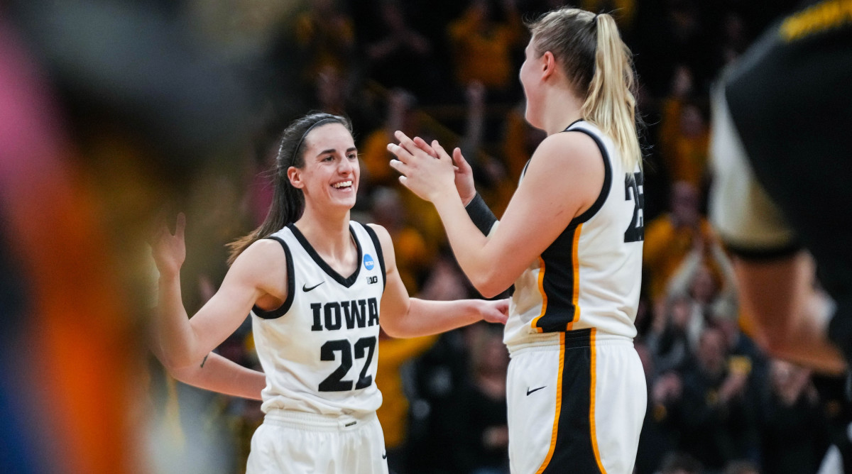 Iowa guard Caitlin Clark celebrates with center Monika Czinano after defeating Georgia in the second round of the NCAA tournament.
