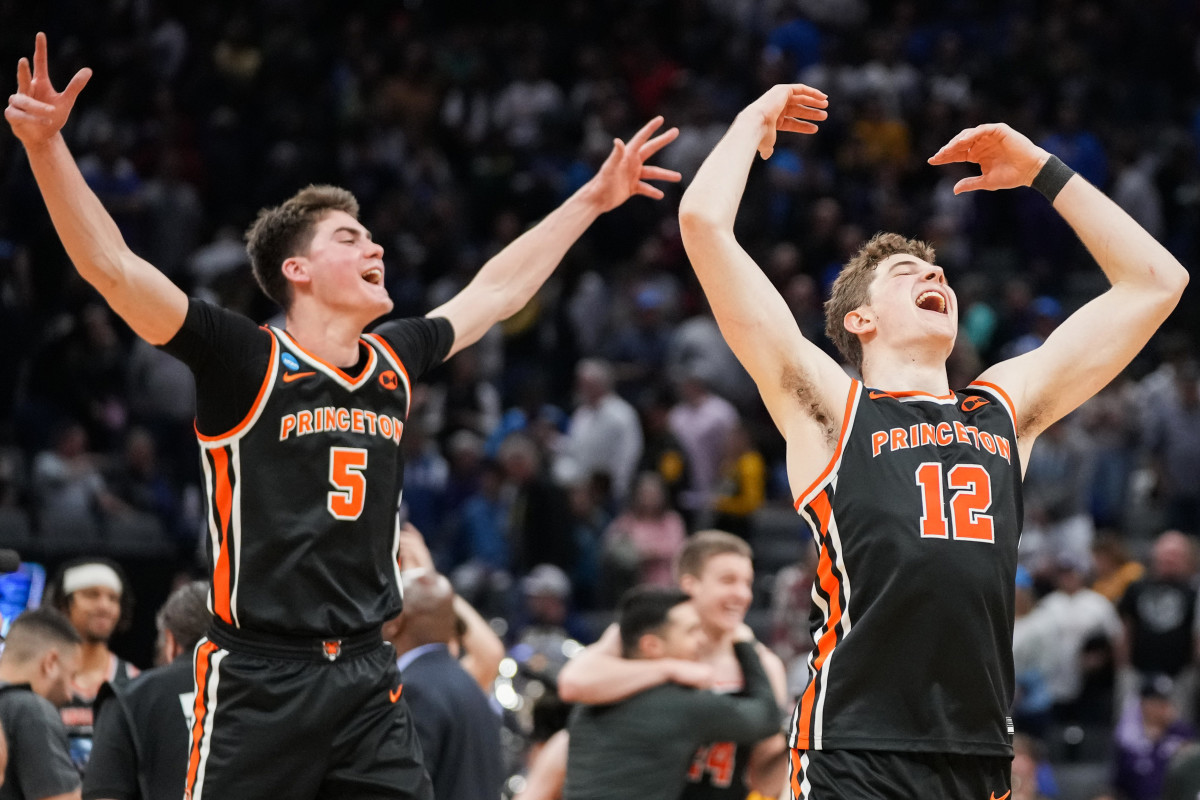 Princeton forward Caden Pierce (12) and guard Jack Scott (5) celebrate after defeating Missouri in Round 2 of the NCAA tournament.