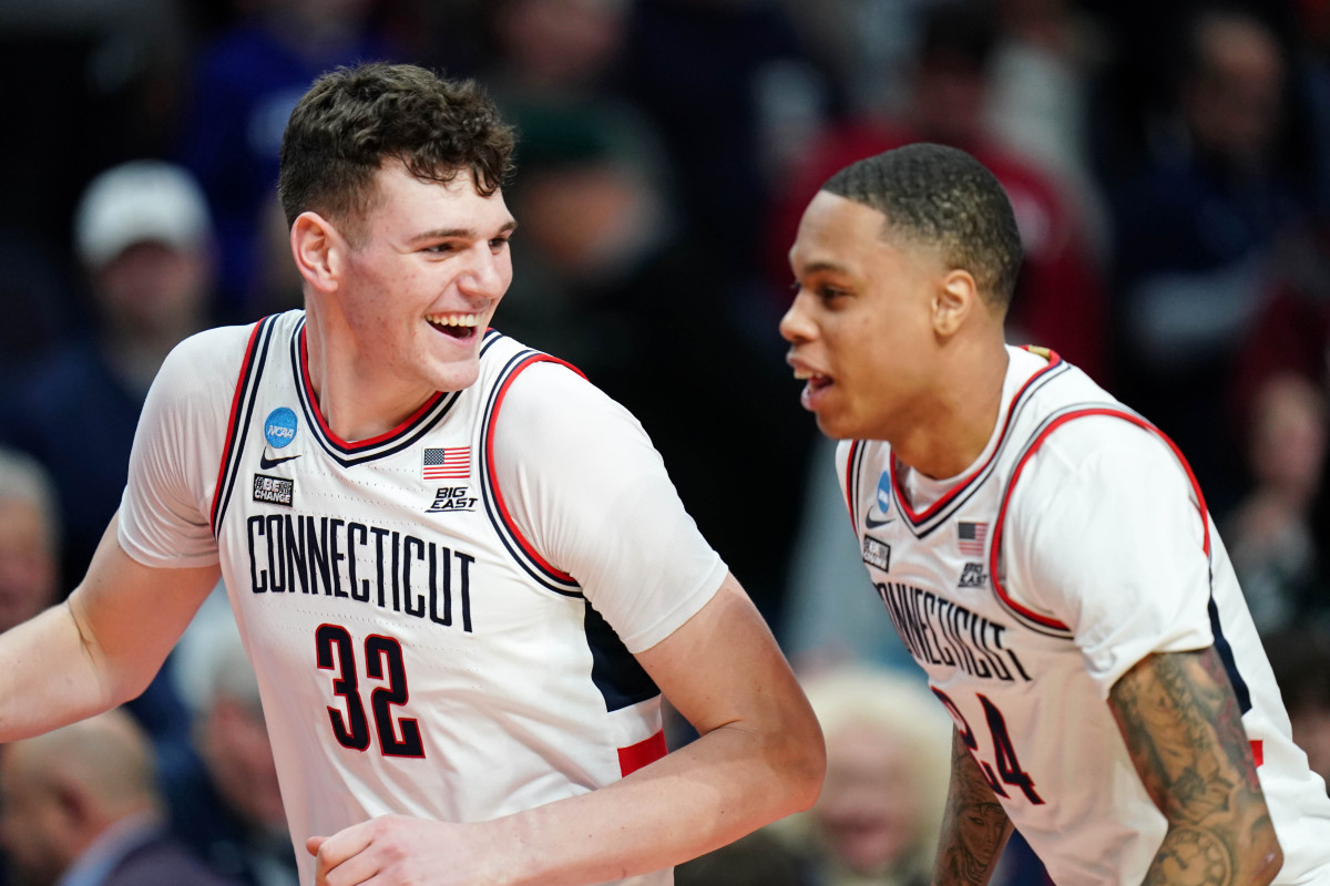 UConn players celebrate advancing to the Sweet 16.