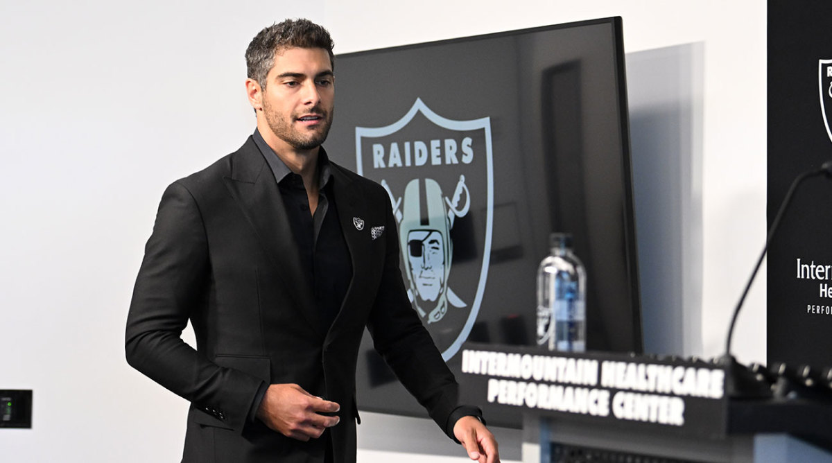 Jimmy Garoppolo walks up to the podium at his Raiders intro press conference