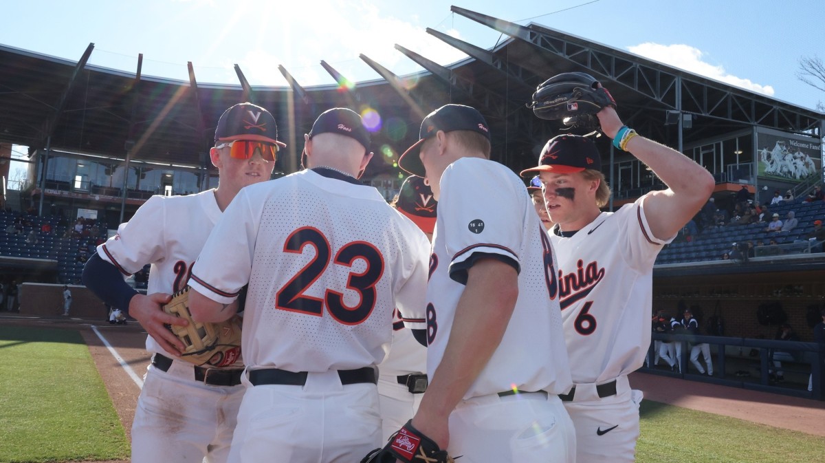 The Virginia baseball team huddles on third base during the game against William & Mary at Disharoon Park.