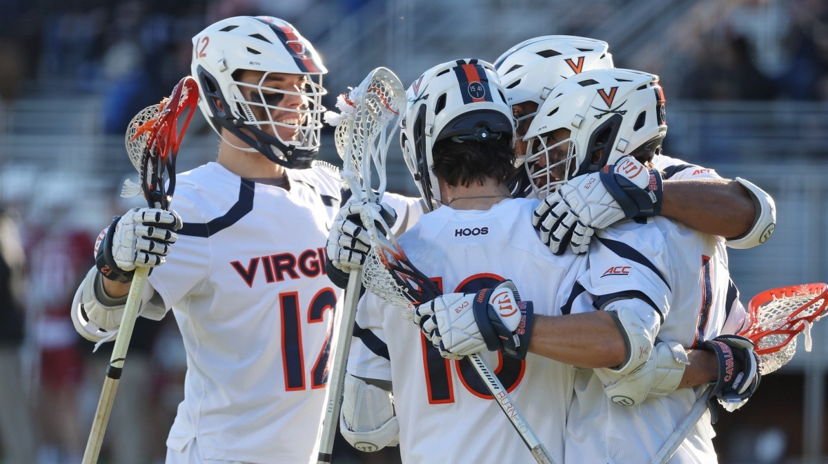 The Virginia men's lacrosse team celebrates after a goal during the game against Harvard at Klockner Stadium.